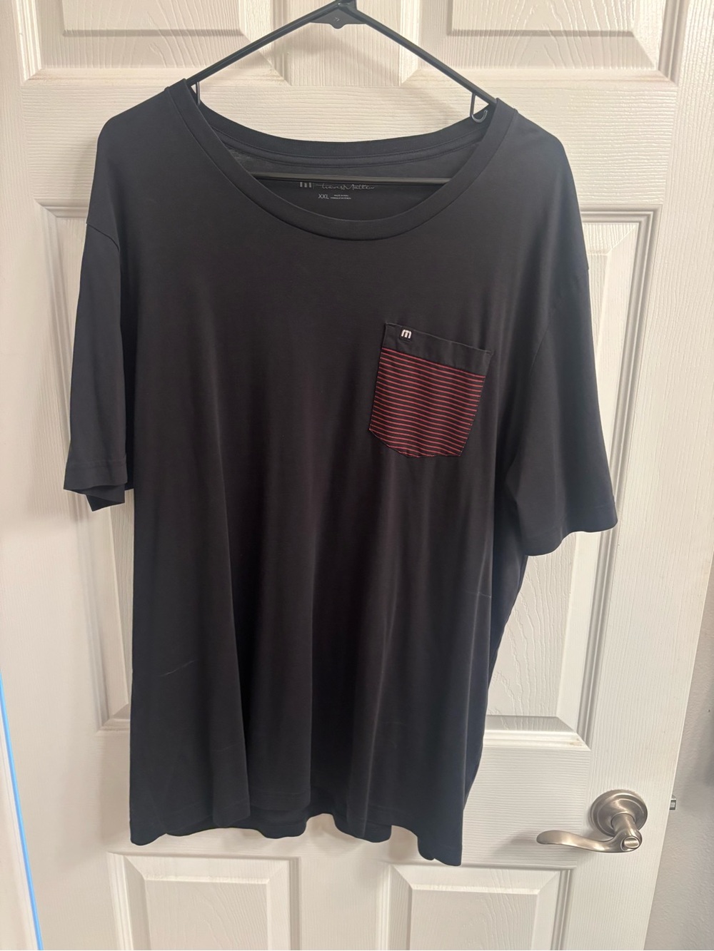 TravisMathew Black Short Sleeve Tee with Red-Striped Chest Pocket